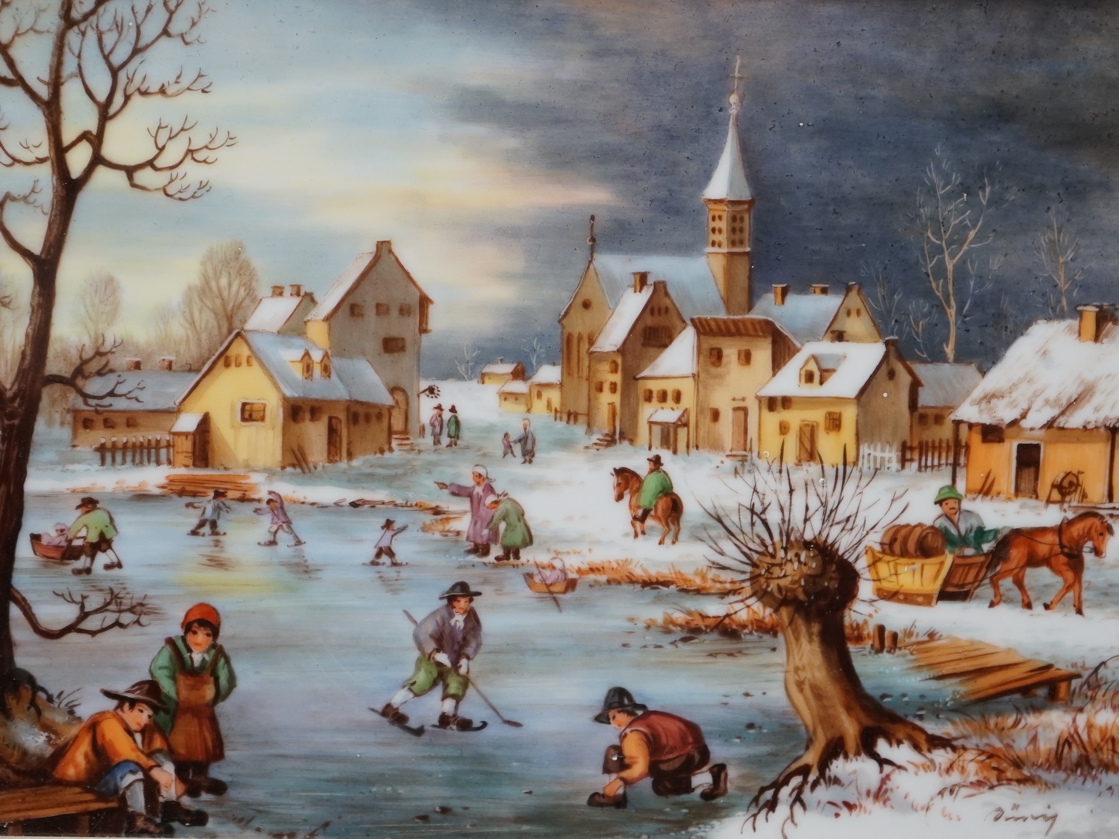 A West German porcelain plaque hand painted with a winter landscape and figures skating, indistinctly signed, 17 x 23cm